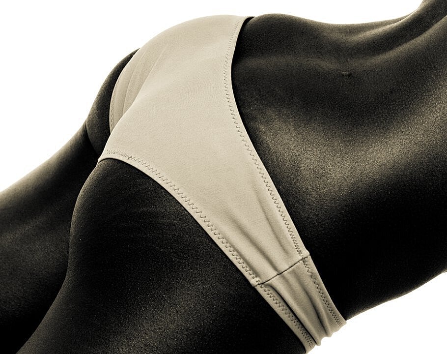 Close-up of bikini on dark skin.