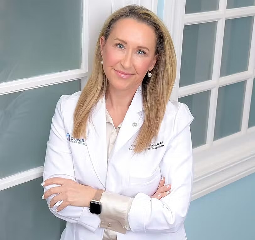 Smiling healthcare professional in a white coat.