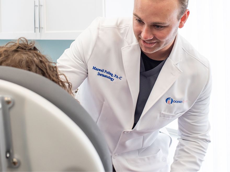 Dermatologist consulting with patient in office.