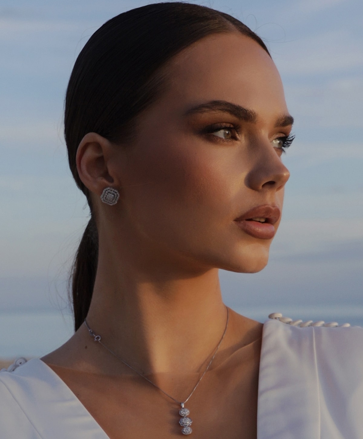 Smiling woman sitting comfortably on a sofa.