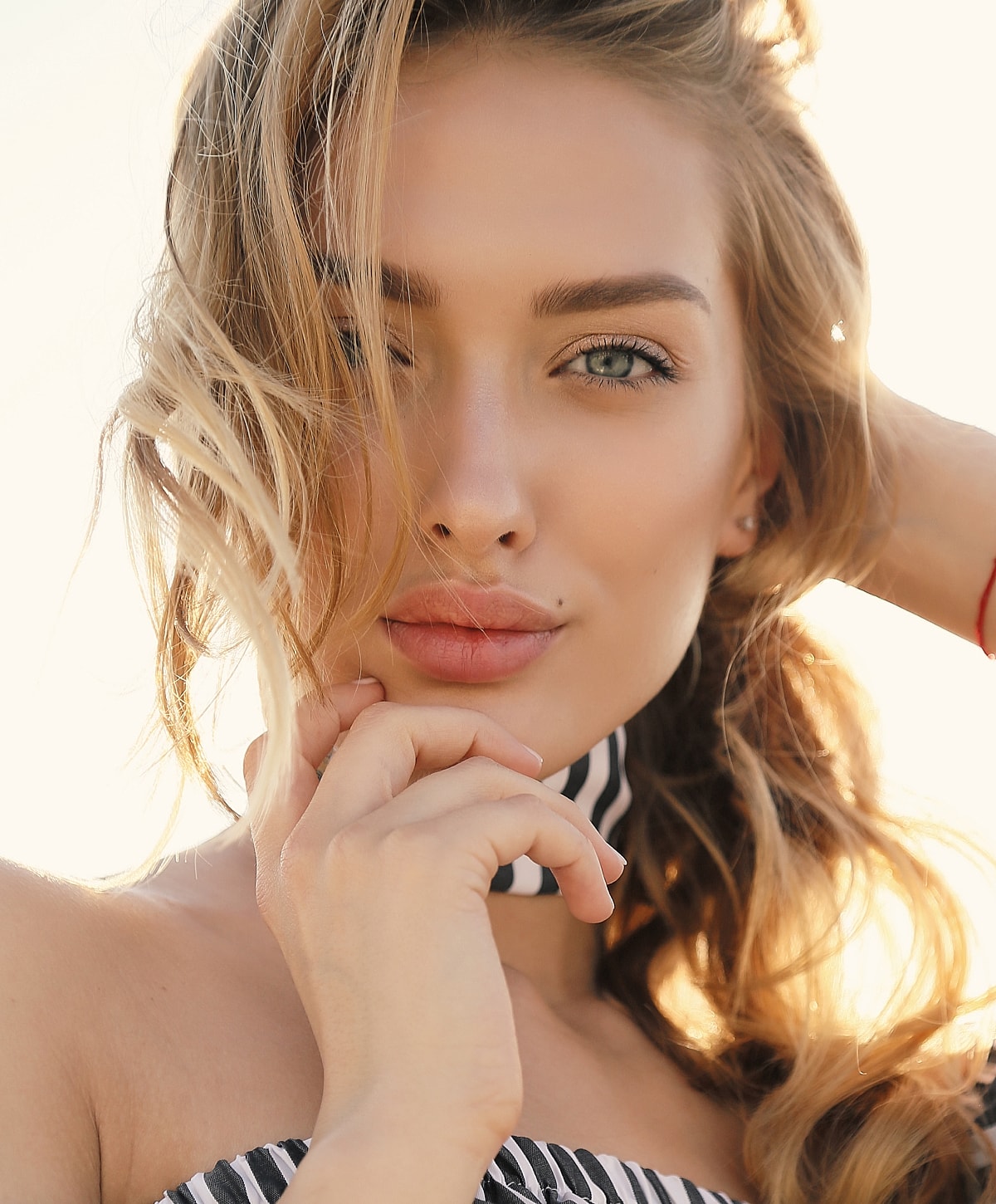 Coastal view with buildings and sandy beach.