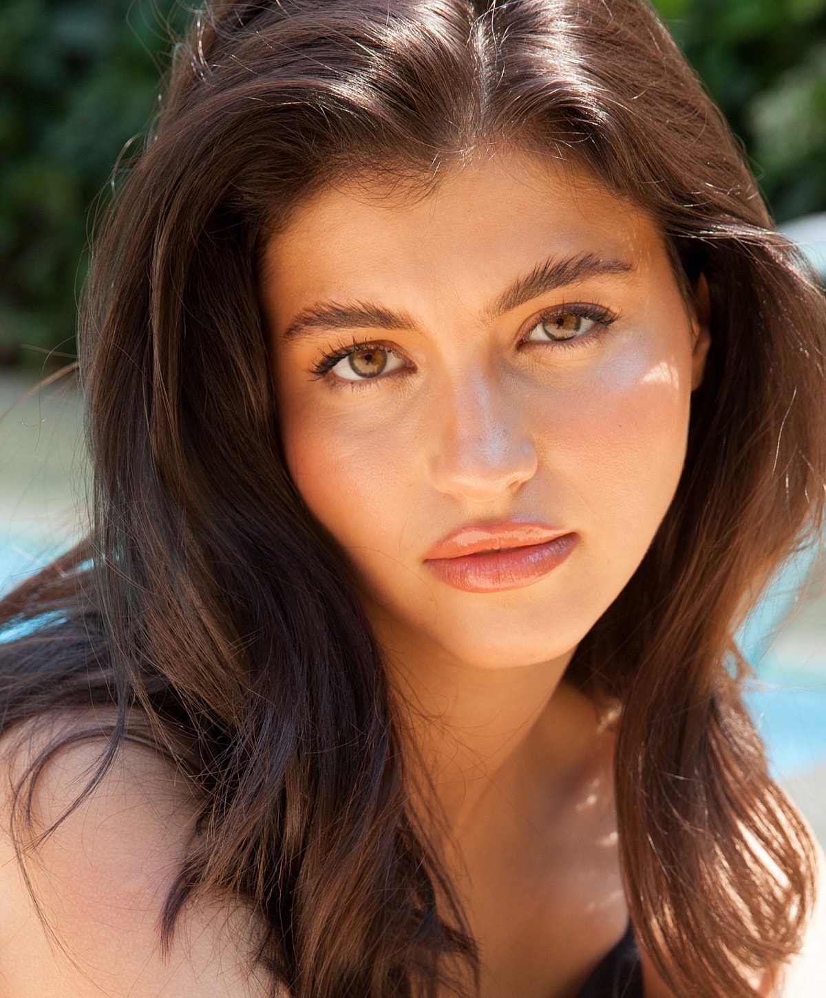 Young woman with brown hair and natural makeup
