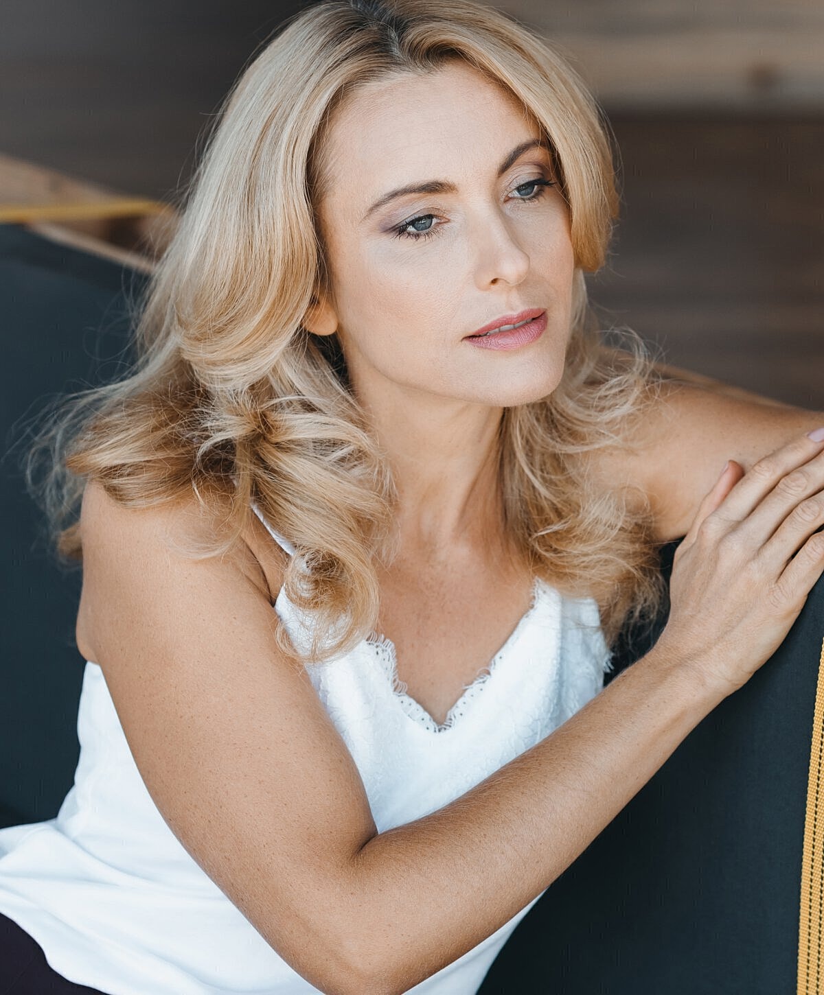 Thoughtful woman resting on her hand.