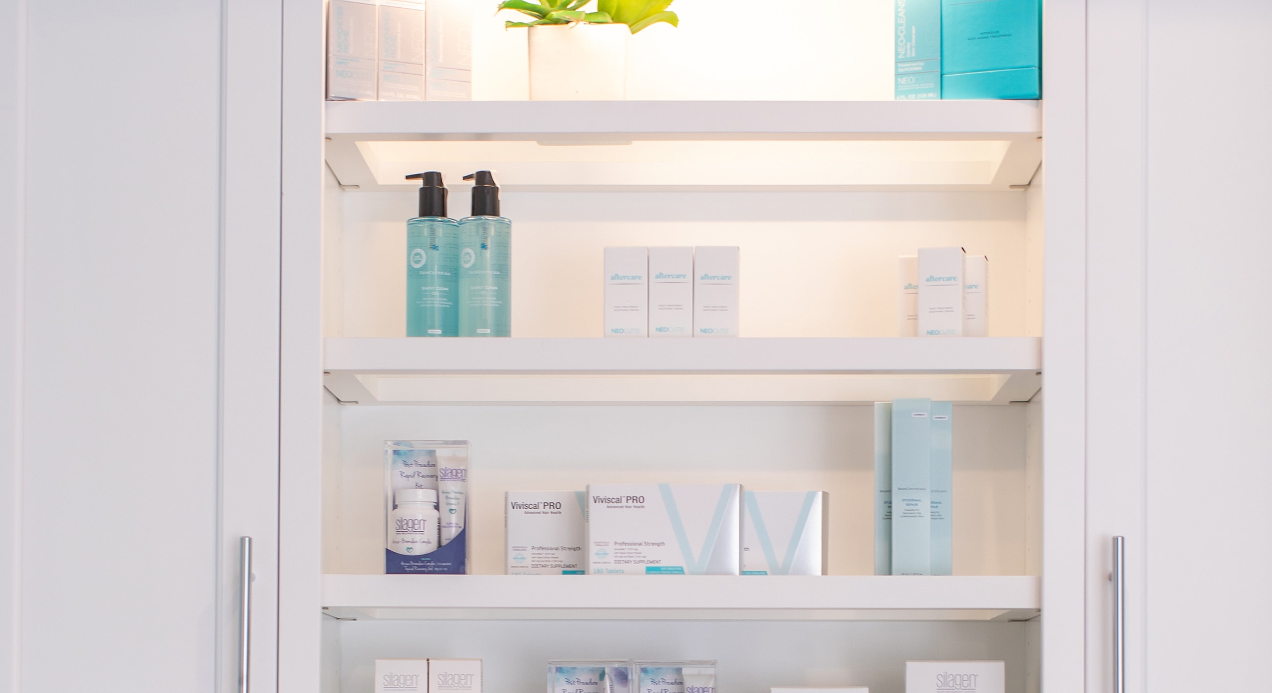 Skincare products displayed on organized shelves.