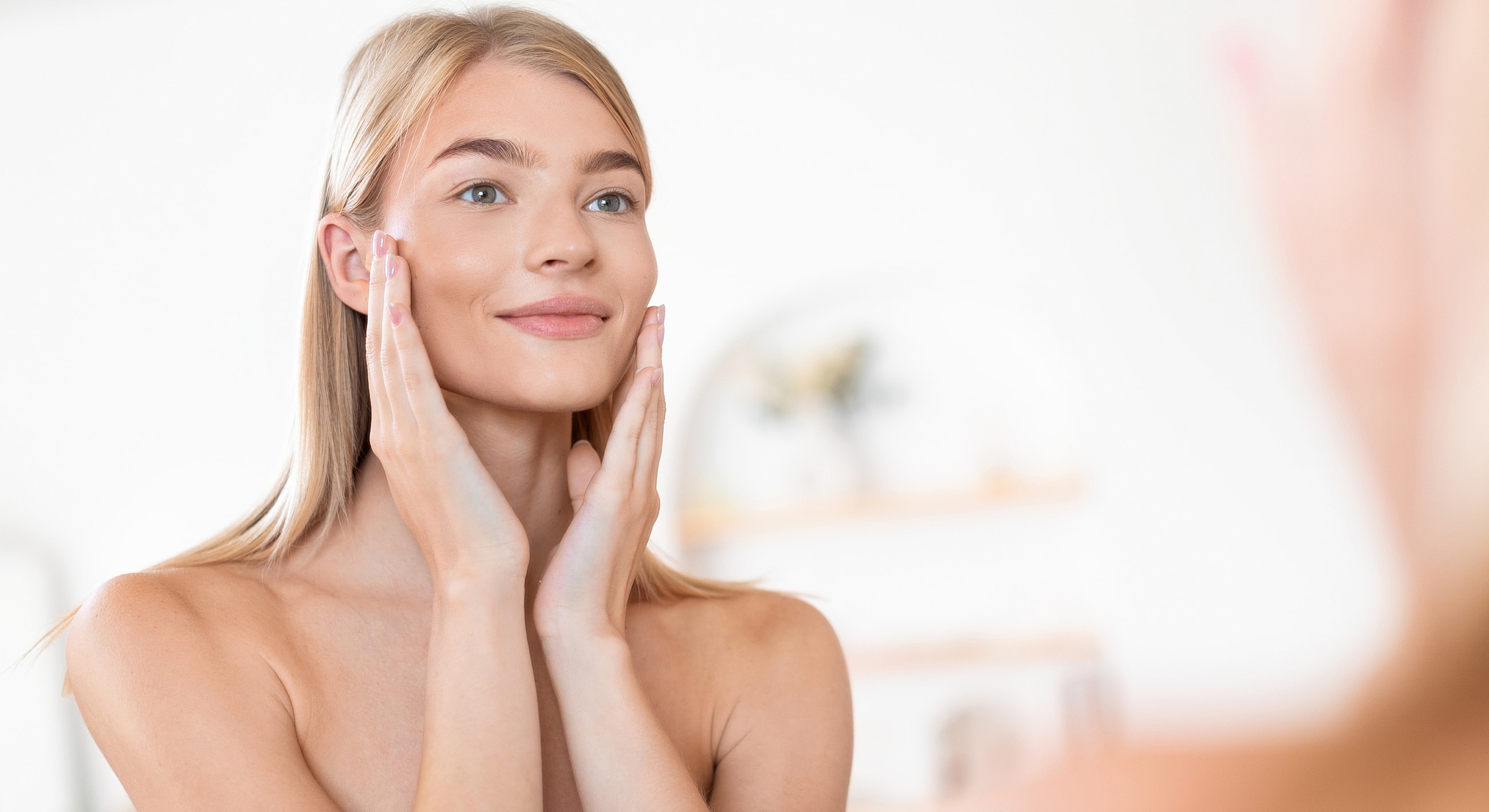 Woman relaxing in pool with sunlight reflections.