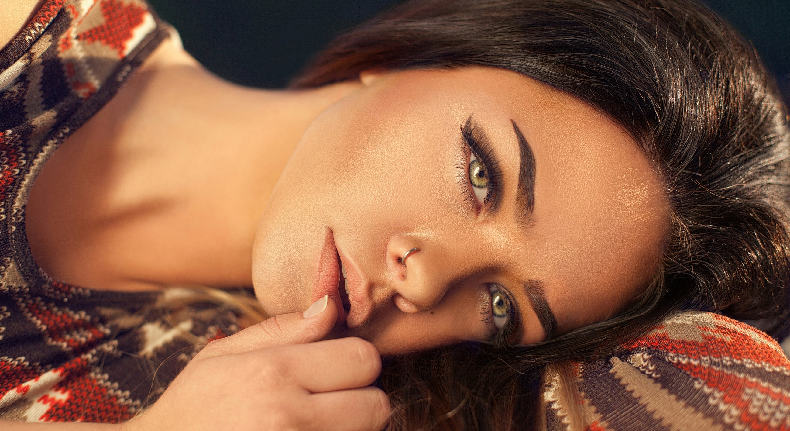Close-up of a woman with striking eyes.