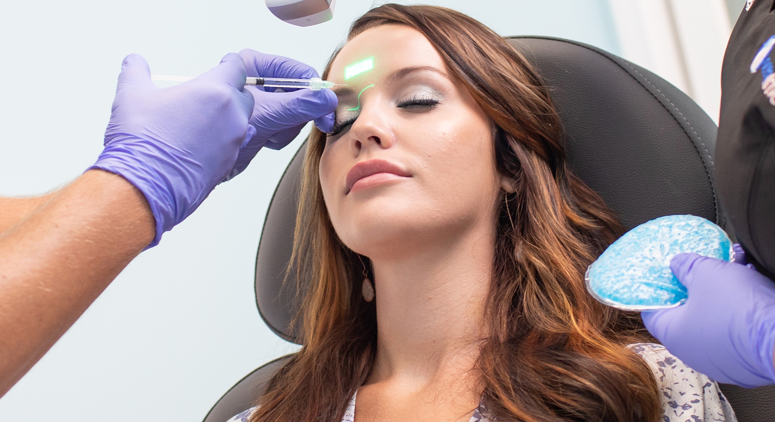 Patient receiving a cosmetic procedure at clinic.
